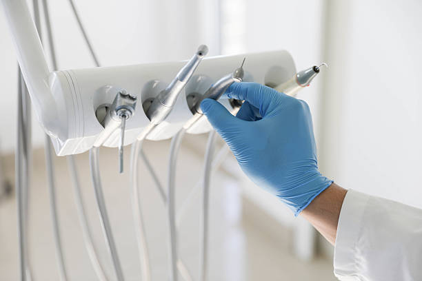 Professional Tooth Extraction technician working in Manitou Beach-Devils Lake, MI